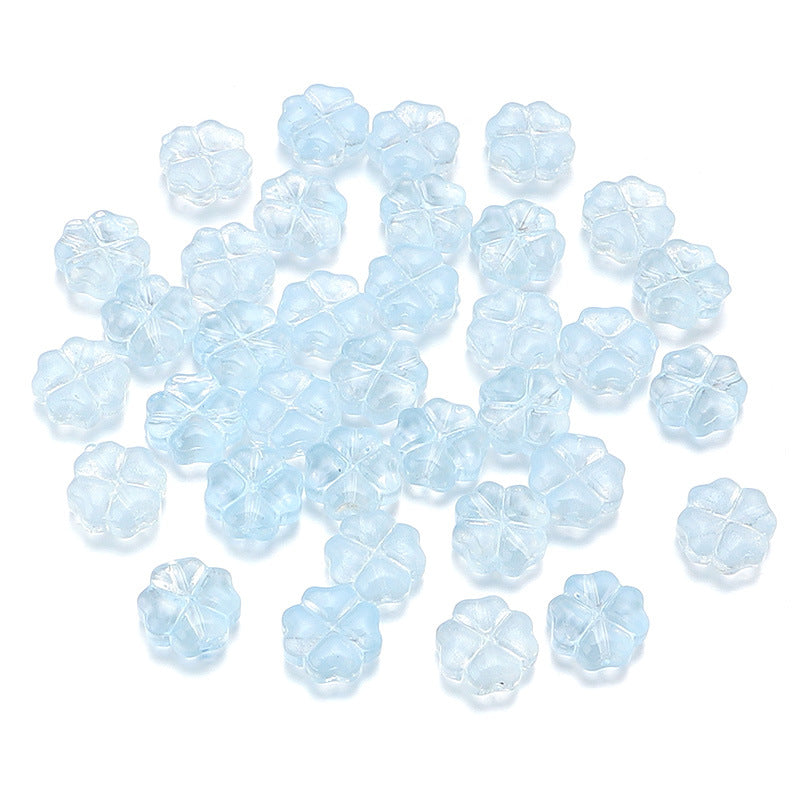 Al por mayor de 50 piezas/paquete de vidrio de color transparente de color trébol de cuatro hojas